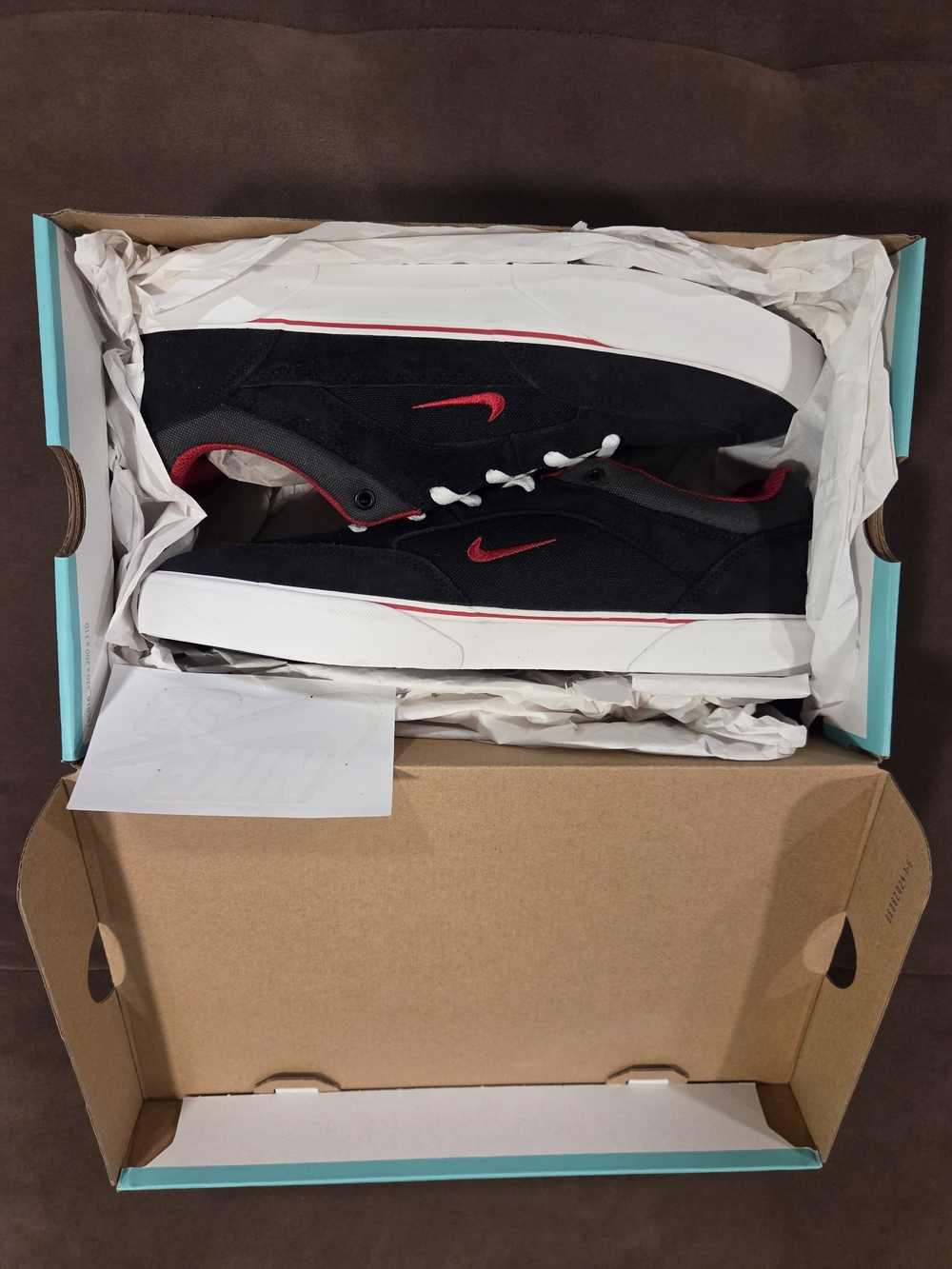 Nike Black Low-Top Sneakers with Red Swoosh